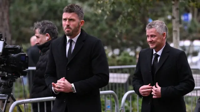 Carrick and Ole in black together