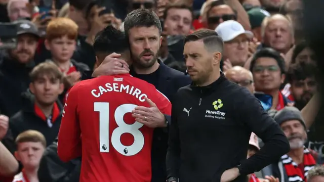 Casemiro hugged by Carrick