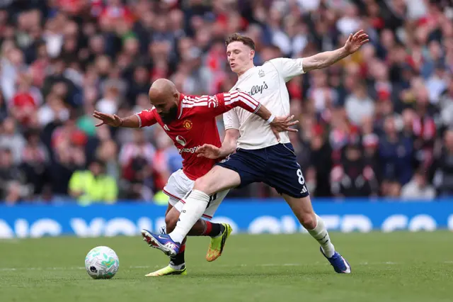 Elliot Anderson of Nottingham Forest in a white jersey with black shorts