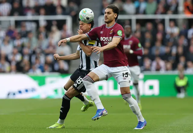 illiam Osula of Newcastle United and Konstantinos Mavropanos of West Ham United battle for possession during the Premier League match between Newcastle United and West Ham United