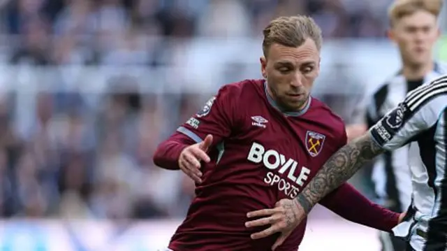 Sandro Tonali of Newcastle United is put under pressure by Jarrod Bowen of West Ham United during the Premier League match between Newcastle United and West Ham United
