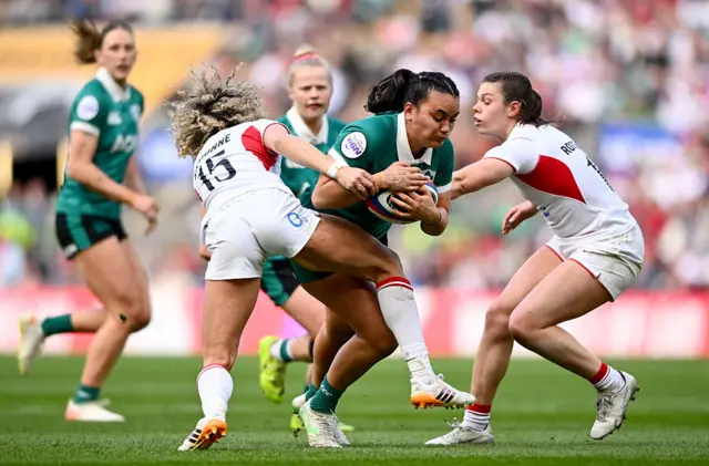 Ellie Kildunne and Abbie ward tackling an Ireland player