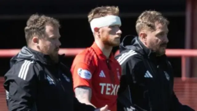 Aberdeen defender Mats Knoester receives treatment