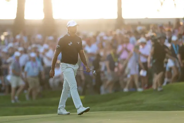 Aaron Rai strides to the 18th green