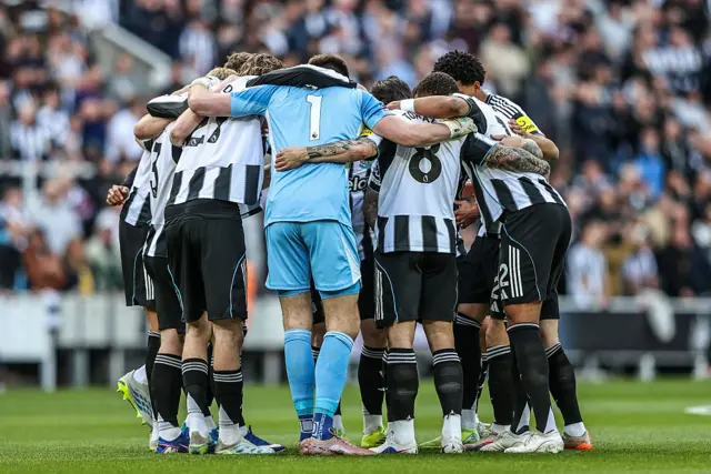 Newcastle players gather in a team huddle during the Premier League match between Newcastle United and West Ham United at St. James's Park in Newcastle, United Kingdom