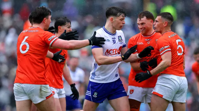 Monaghan's Bobbie McCaul with Jason Duffy and Greg McCabe of Armagh