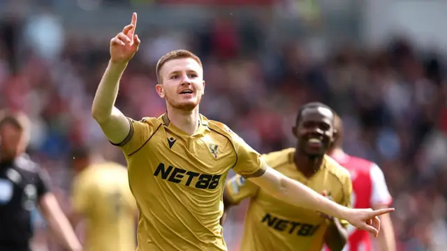 Wharton celebrates a goal