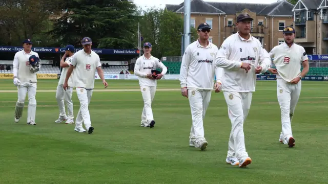 Essex captain Tom Westley leads his players off the field