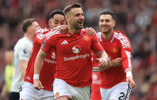 Luke Shaw celebrates with other Manchester United players
