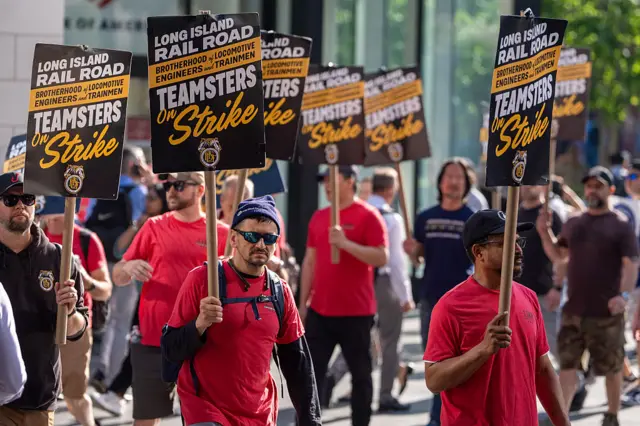striking rail workers outside Penn Station in New York