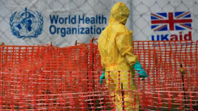 A person dressed in Ebola protective clothing is seen outside an Ebola care facility at the Bwera general hospital neat the border of DRC in Bwera, Uganda