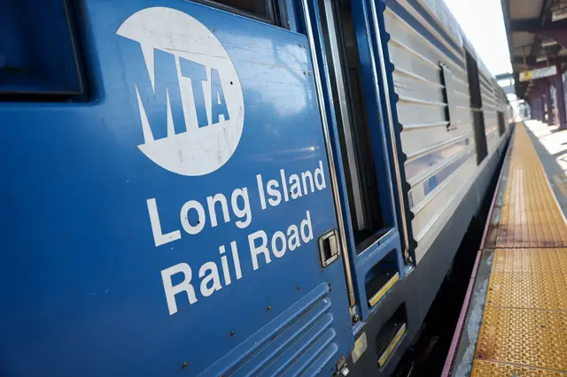the side of a train with the Long Island Rail Road and MTA logo