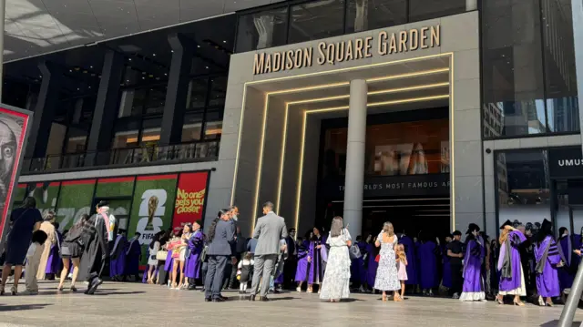People line up for a graduation ceremony outside New York's Madison Square Garden arena
