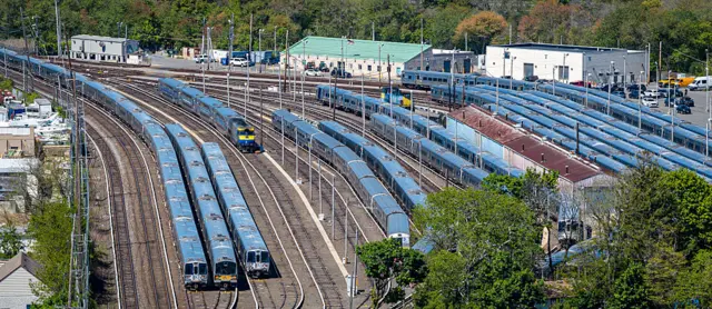 Long Island Rail Road trains stand unused at the Babylon yard in West Islip, New York