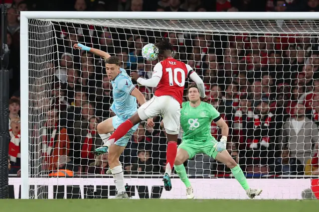 Ese heads the ball