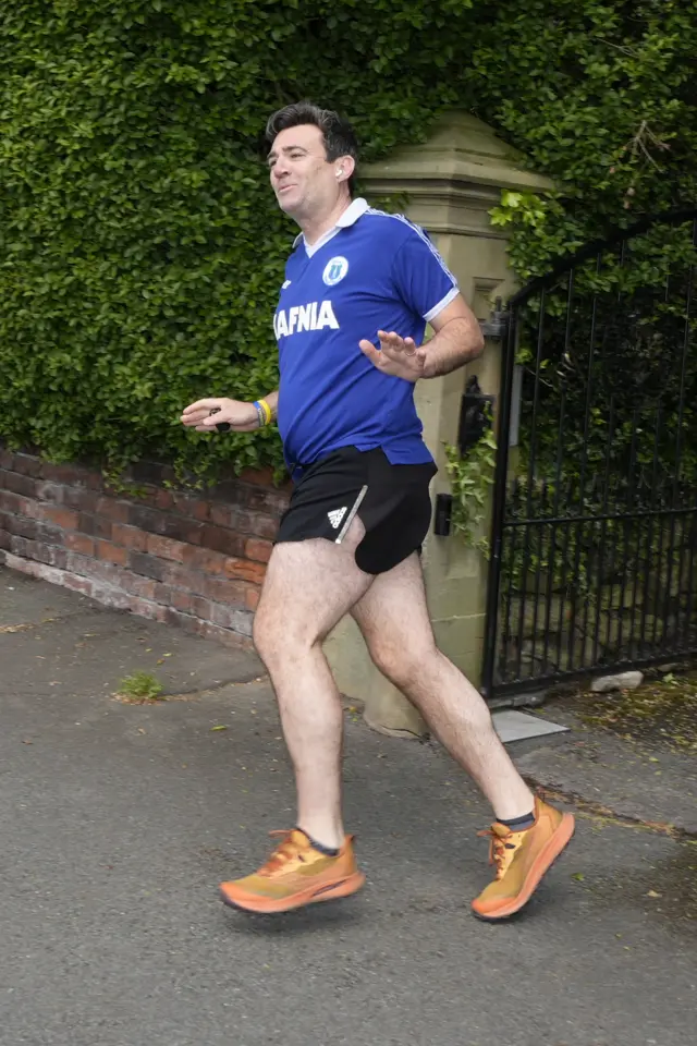 Burnham in retro Everton shirt and running shorts