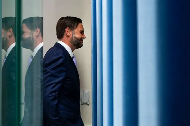 Vice President JD Vance viewed from the side as he exits the White House briefing room
