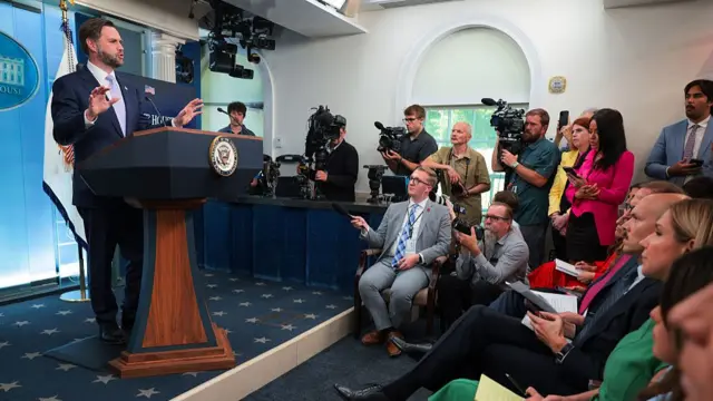 Vance that podium, with reporters seen in their seats
