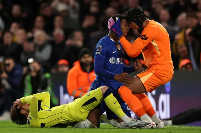 Jorrel Hato reacts with Chelsea's Spanish goalkeeper #01 Robert Sanchez after blocking a shot from Tottenham Hotspur's English midfielder #10 James Maddison