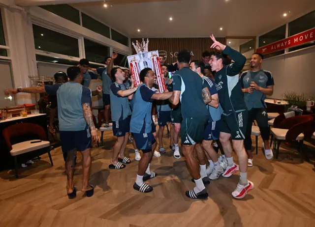 The Arsenal players celebrate winning the Premier League after watching AFC Bournemouth v Manchester City at Sobha Realty Training Centre