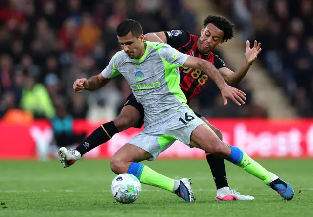 Rodri of Manchester City is challenged by Tyler Adams