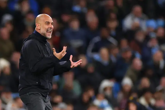 Pep Guardiola the head coach reacts on the touchline