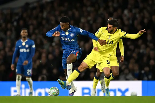 Dario Essugo of Chelsea is challenged by Rodrigo Bentancur