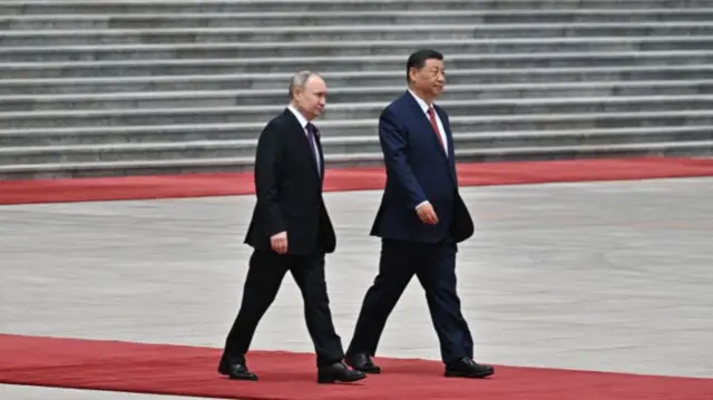 Xi and Putin walking on a red carpet - file photo from 2024
