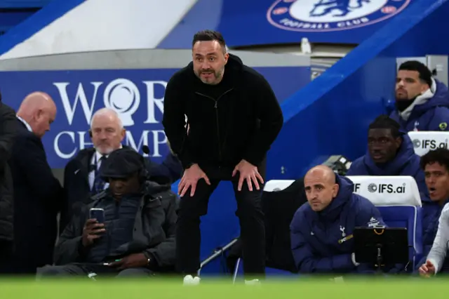 Tottenham Hotspur's Italian head coach Roberto De Zerbi watches the players from the touchline
