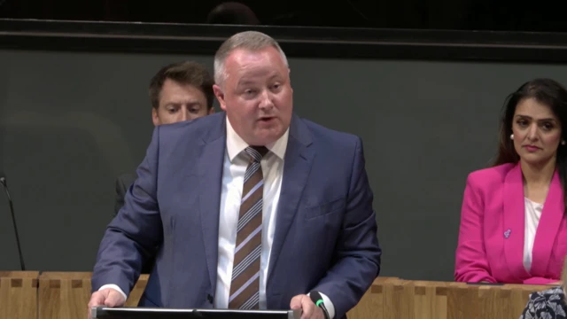 Darren Millar speaks in the Senedd
