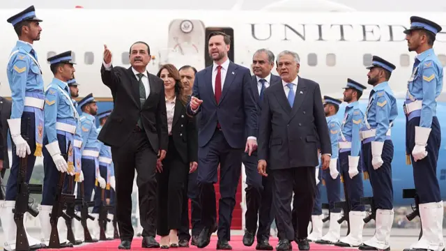 S Vice President JD Vance (C) walks with Pakistan's Chief of Defence Forces and Chief of Army Staff Field Marshall Asim Munir (L) and Pakistani Deputy Prime Minister and Foreign Minister Mohammad Ishaq Dar after arriving for talks with Iranian officials in Islamabad on April 11, 2026