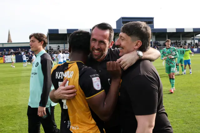 Newport boss Christian Fuchs celebrates keeping the club in League Two with victory at Barrow