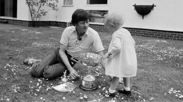 Alex Higgins and daughter Lauren with the World Championship trophy at the family home in Cheadle