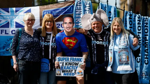 Coventry fans gather at Watford with one wearing a Frank Lampard mask and Superman outfit