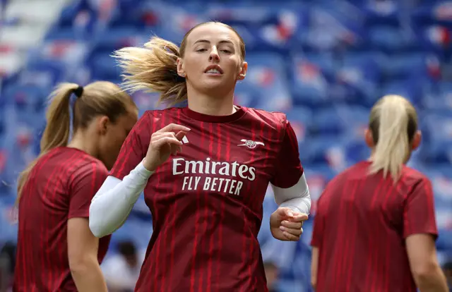 Chloe Kelly of Arsenal warms up prior to the UEFA Women's Champions League 2025/26 Semi-Final Second Leg match between OL Lyonnes and Arsenal FC at OL Stadium.