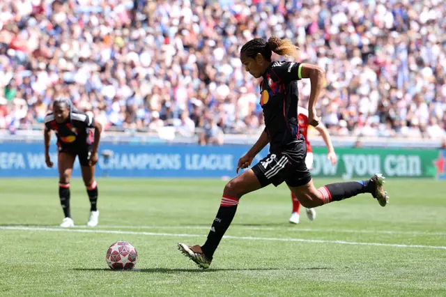 Wendie Renard of OL Lyonnes scores her team's first goal from the penalty spot during the UEFA Women's Champions League 2025/26 Semi-Final Second Leg match between OL Lyonnes and Arsenal FC at OL Stadium.