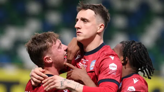 Joel Cooper celebrates his goal