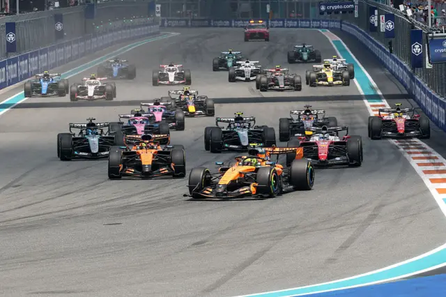 Lando Norris leads Oscar Piastri and the rest of the field at the sprint race start