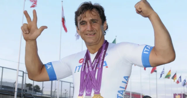Alex Zanardi celebrates winning three medals in handcycling at the Paralympics in London in 2012