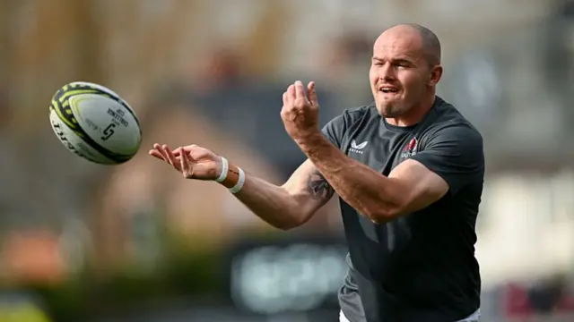 Jacob Stockdale throws a ball on the pitch