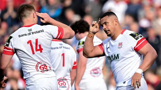 Juarno Augustus salutes to a team-mate after scoring