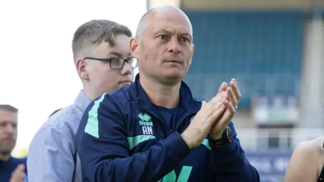 Alex Neil claps the fans after Millwall's win against Oxford