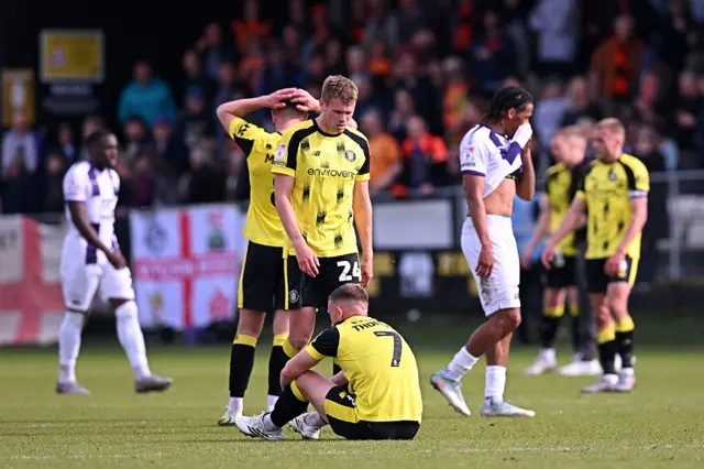 Harrogate players are dejected following relegation from League Two