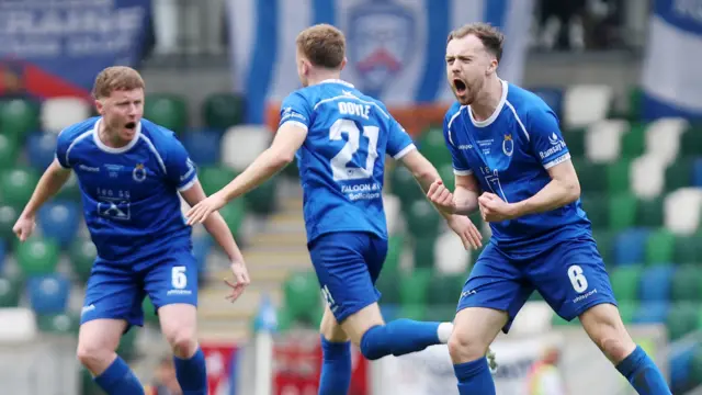 Paul Doyle celebrates his goal for the Swifts