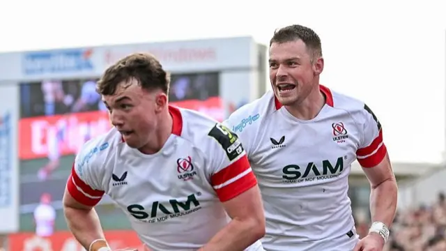 Jack Murphy (left) runs to score a try