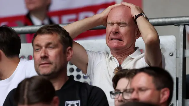 Fans of West Ham United look dejected d