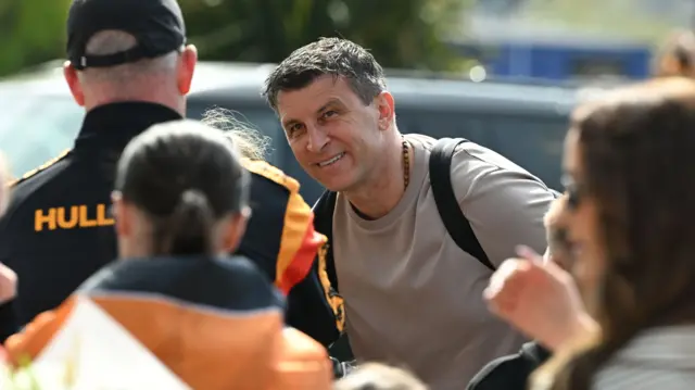 Sergej Jakirovic smiles outside the MKM Stadium
