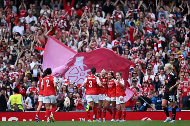 Arsenal celebrate scoring a goal in the first leg