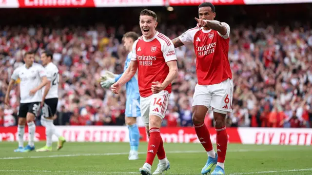 Viktor Gyoekeres of Arsenal celebrates scoring his team's first goal with teammate Gabriel