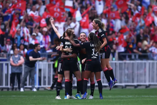 Lyon players celebrate full time